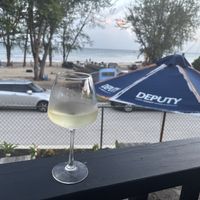 Glass of wine with a beautiful view!  at Casper's Beachside  in Oistins