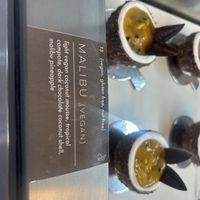 So good - I thought passionfruit but apparently “Malibu pineapple” - regardless dark chocolate shell with coconut mousse and the tropical filling was so delicious!   at Origami - Napier in Napier