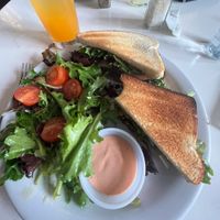 Vegan “steak” sandwich with side salad and passion fruit juice   at St Germain Bistro and Cafe in San Juan