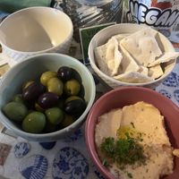 From the mezze & starters menu: olives and spicy Feta dip   at The Crazy Little Greek in Berlin