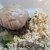 Burger and POPCORN!! 🧡🧡🧡 at Unrefined Wellness Bar in Eugene