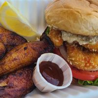 Shrimp burger with tartar sauce and plantains  at Sealevel City Vegan Diner in Wilmington