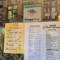 Happy Cow window decal 😊 at Tasty Bruges in Bruges