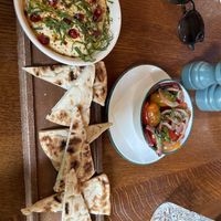 Hummus con pita e insalata di pomodorini   at Cosy Club  in Oxford