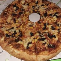 vegan cheese with sweetcorn, mushrooms and olives at Caprinos Pizza in Cardiff