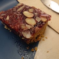 Cherry Bakewell Tart (half eaten) at Hustle in Belfast