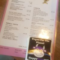 Menu and happycow seal of approval at Hustle in Belfast