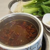 Hot & spicy broth at Homey Hot Pot in Bloomington