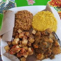 Tofu tibs, spicy potatos, curry split peas, spicy lentils at Azla Vegan in Los Angeles