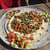 Tel Aviv mix: Shawarma with mince, portobello + onions, on laffa bread with hummus, salad, tahini and harissa sauce (18€) at TWO SIX NINE in Frankfurt