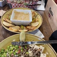 Grain bowl, hummus plate and vegan burger   at Mad Trapper's Saloon in Banff