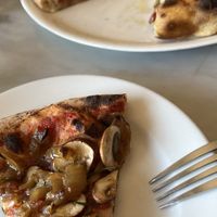 Fungo Pizza: Mushrooms, Caramelized Onions, Crushed Tomatoes & Rosemary at Hearth & Table in Lincoln City