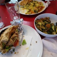 Soy burger, fried tofu with rice and side dish of vegetables. at Vege Fast Food in Split