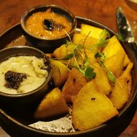 Crispy idli - the red orange sauce has a tinge of spice and the white one is coconut based and cooling at Doolally in Dublin