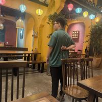 So much attention to decorations and he dresses like that shaking his hands with restlessness and awkwardness at Metta Vegetarian in Ho Chi Minh City