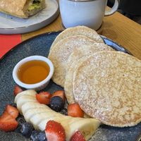 Pancakes with fruit and golden syrupp  at Rolling Oats in London