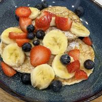 Pancakes with fruit  at Rolling Oats in London