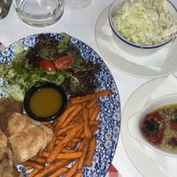 the "shaorma" (seitan) with sweet potato fries and a salad, with a side of cabbage salad and roasted peppers and garlic (although these weren't as "charred" as i was expecting!)  at Mali Vrabac in Belgrade