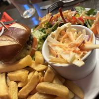 Plant based burger (Moving Mountains?) vegan slaw, healthy portion of chips and an excellent salad with a fantastic mustard dressing    at The Station Inn in Carnforth