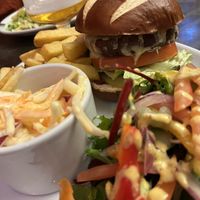 Plant based burger, coleslaw, chips and salad    at The Station Inn in Carnforth