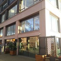 Corner venue with outside seating overlooking the water at Café Spice Namasté in East London