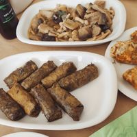 Stuffed zucchini flowers, dolmades, marinated mushrooms and handmade pitta bread at Glossitses in Crete