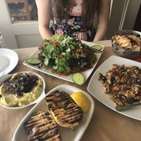 Our meal, tomato and mushroom risotto, pita and fera, grilled potatoes, green salad. at Glossitses in Crete