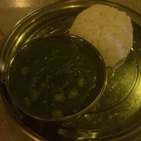 Spinach chickpea curry with ricee  at Hathim Indian Food - Sunset View in Don Det