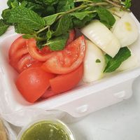 Tomatoes, onion, mint, green sauce at AlTayeb Restaurant in Dearborn