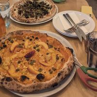 Vegan King Mushroom (top) and special peaches and corn (bottom) both fully vegan and both delicious! at Pizzeria Tratto Napoletana in Penticton