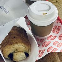 Pain au chocolat and latte  at Shotwave Coffee in North West London