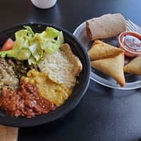The vegan bowl and sambusa's on the side. at Hilltop Cafe in Minneapolis