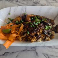 Vegan Liberian Jollof Rice with eggplant and fried plantains at Legacy Village West African Cuisine in Muncie