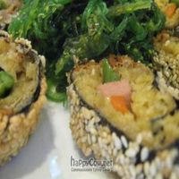 Sesame-crusted seaweed roll with mock meat and vegetables at the core; Chinatown's answer to sushi! Served with a pile of sea vegetables. at The Original Buddha Bodai - Kosher Vegetarian Restaurant in New York City