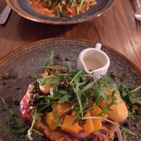 Tarte tatin with chicory and ravioli with tomato sauce at Bar Verde in Maastricht