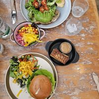 Burger with vegan cheese, coleslaw, sourdough with avocado, tofu with peanut sauce at Mad Cucumber in Bournemouth