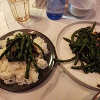 A smoky green bean dish with burnt garlic and dry chili bits... simple but to die for at The Corner in New York City