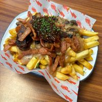 The Frenchie - Classic Poutine topped with Garlic Mushrooms,
vegan Bacon & Red Onion Marmalade at The Gravy Train Poutine - Neepsend Social Club & Canteen in Sheffield