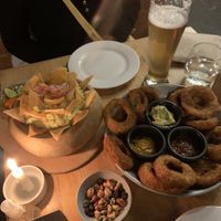 Guac and onion rings  at Green Point in Cusco