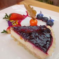 Vegan cheesecake with red fruits at Green Point in Cusco