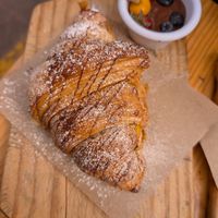 Breakfast sweet croissant - full of fruit! at Green Point in Cusco