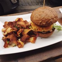 Red lentil burger with roasted eggplant, chilli mayonnaise
and potato spirals. at Plevel in Prague
