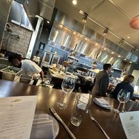 Chef’s table view of main kitchen   at The Kingstide in Charleston
