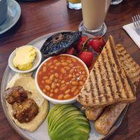 **menu update** vegan breakfast now has a mediterranean twist - falafel and hummus.  There are vegan sausages and hash brown hiding under the toast at Mortimer Bistro in Reading