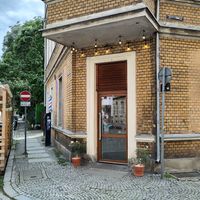 The entrance door is on the corner at Kaffe Bageri Stockholm in Wroclaw