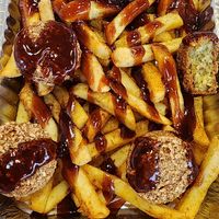 Falafel Loaded Fries with barbecue sauce at DCG - District Chicken and Gyro in Huntsville