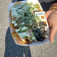 Loaded nachos 😋 at Madrina Vegana in Astoria