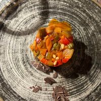 Caponata di carote, zucchine, melanzane sedano con scaglie di cioccolato fondente  at Bataclan in Aosta