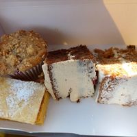 Raspberry white chocolate muffin, custard slice, coffee and walnut and a carrot cake. at Lesley's Vegan Cakes in Nottingham