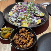 We ordered the Pastore on the side because it wasn’t gluten-free and our friend could eat it. And not all of us like the spicy jalapeños so we asked for those on the side too.  at Marcello's Plant Based Pizza in Cabo San Lucas